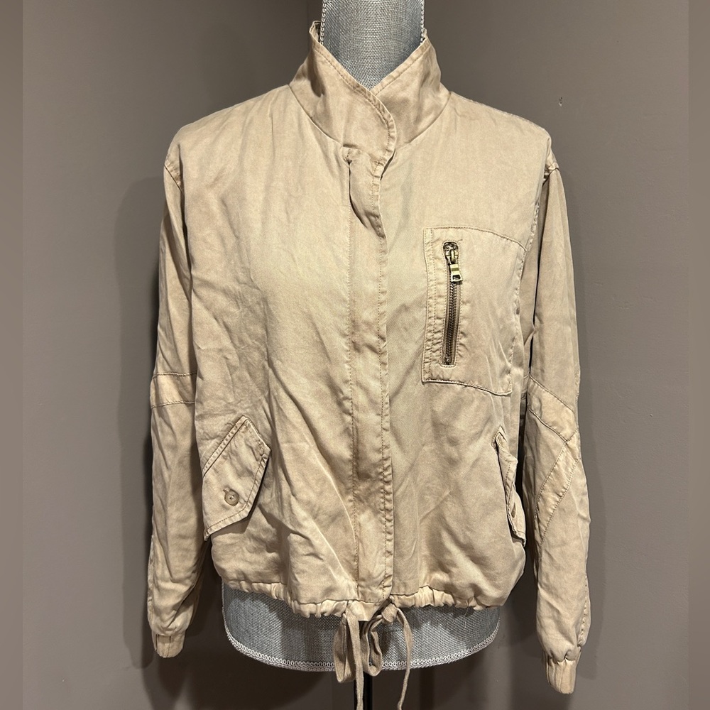 Tan zip-up bomber jacket with drawstring waist